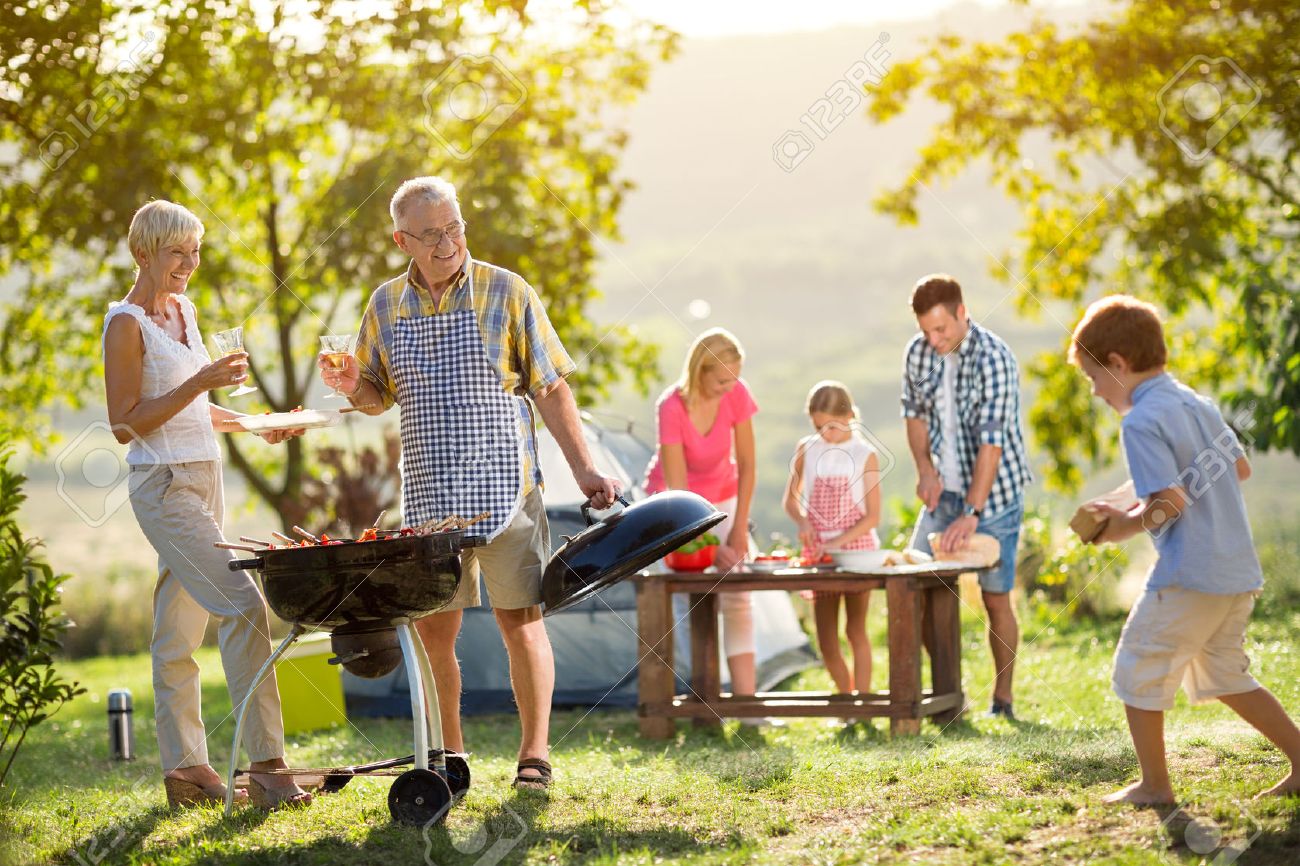 Happy family camping and cooking bbq - 55715789 Happy family camping and cooking bbq - 55715789