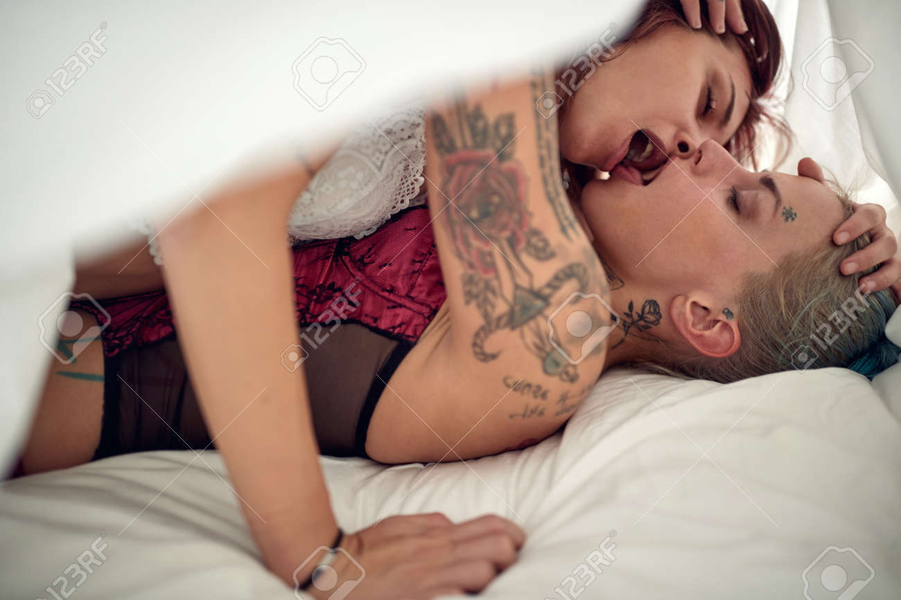 Young Sexy Tattooed Lesbian Couple Full Of Passion Enjoying Wonderful Sex In An Intimate Atmosphere On The pic