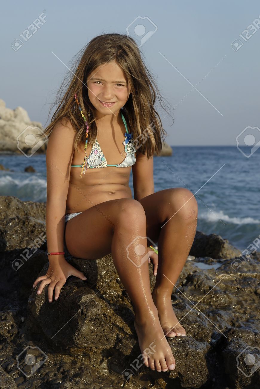Beautiful Young Girl Posing In The Beach Stock Photo, Picture And Royalty  Free Image. Image 9276325.