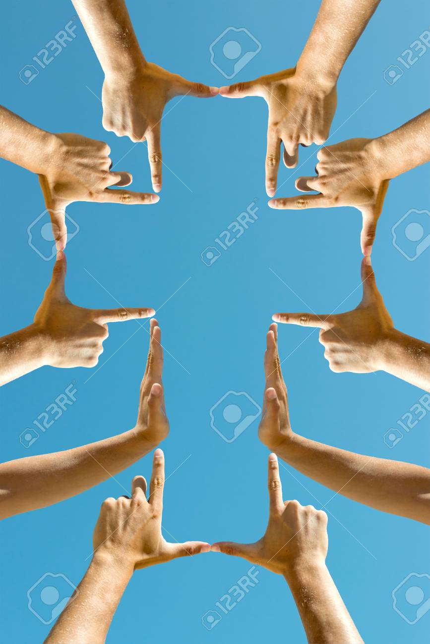 Hands forming a cross against the blue sky - 88974465 Hands forming a cross against the blue sky - 88974465