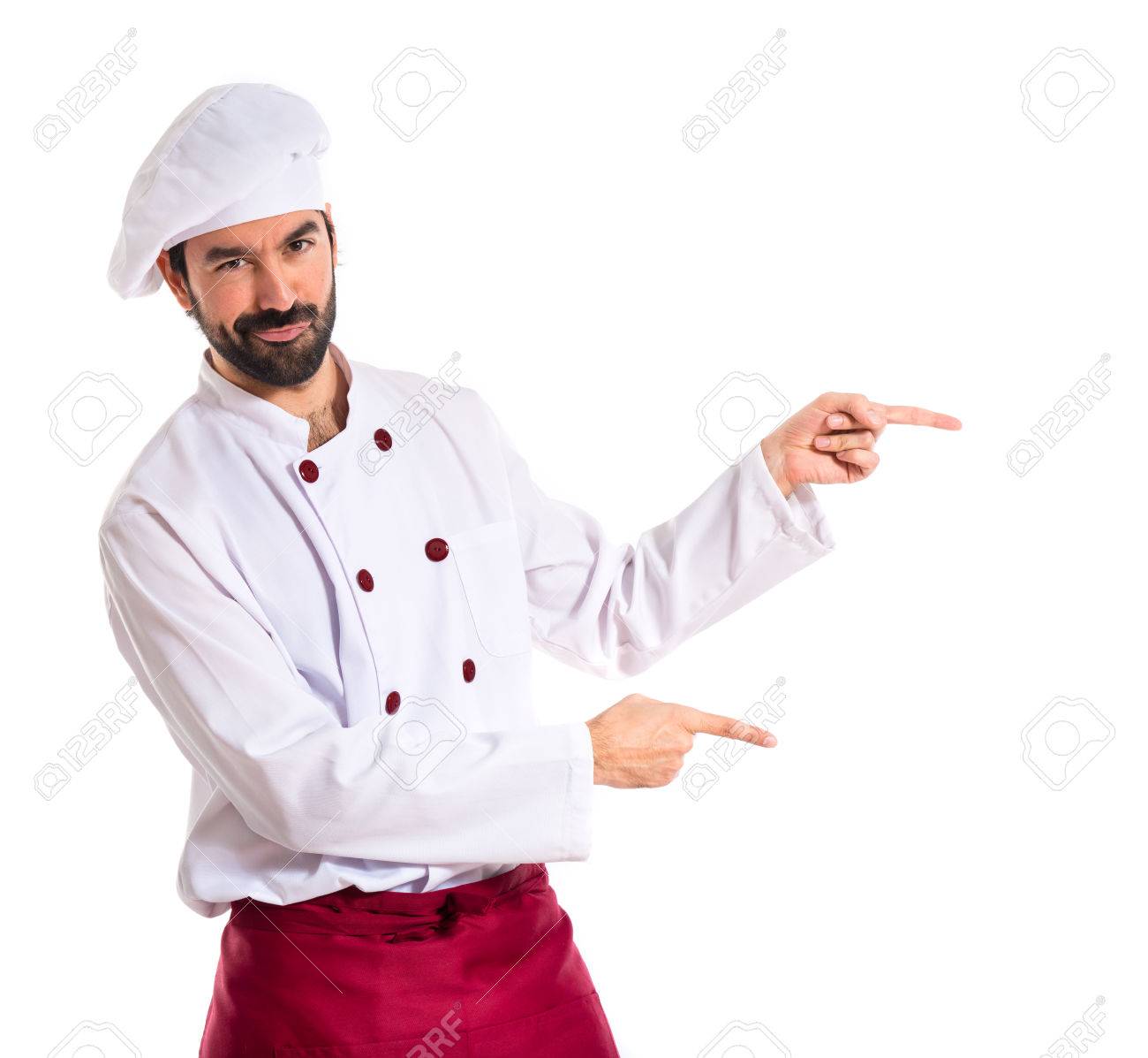 Chef pointing to the lateral over white background - 34710151 Chef pointing to the lateral over white background - 34710151