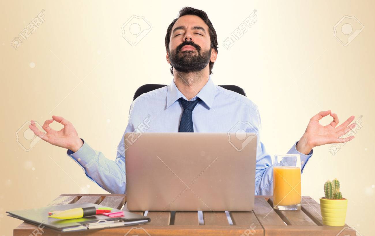 Businessman in his office in zen position - 37676019 Businessman in his office in zen position - 37676019