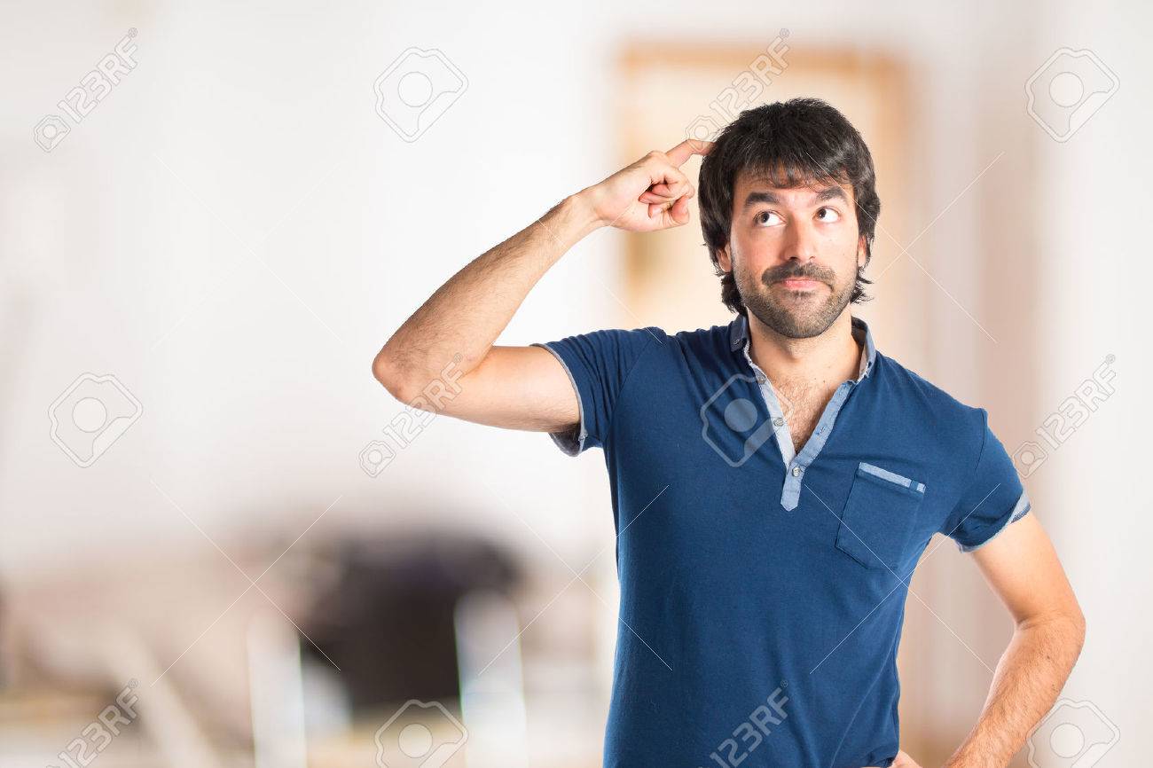 Man thinking over isolated white background - 43935902 Man thinking over isolated white background - 43935902