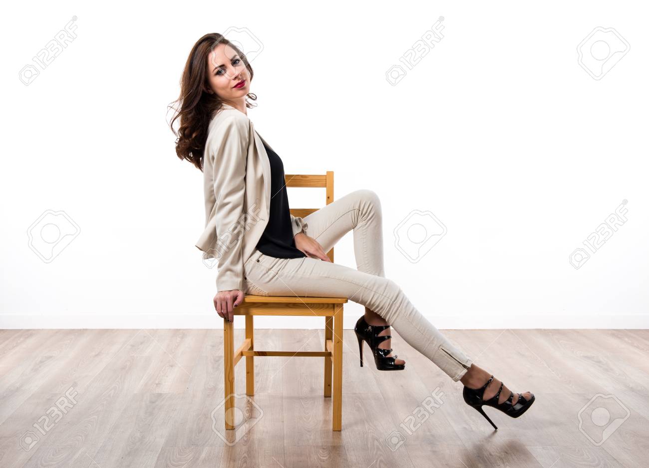 sitting on wooden chair