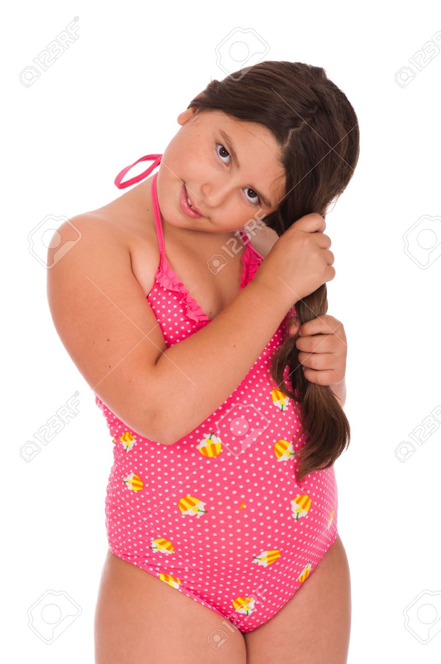 archivio fotografico bella ragazza bruna adolescente in costume da bagno tenendo i capelli isolato su sfondo bianco