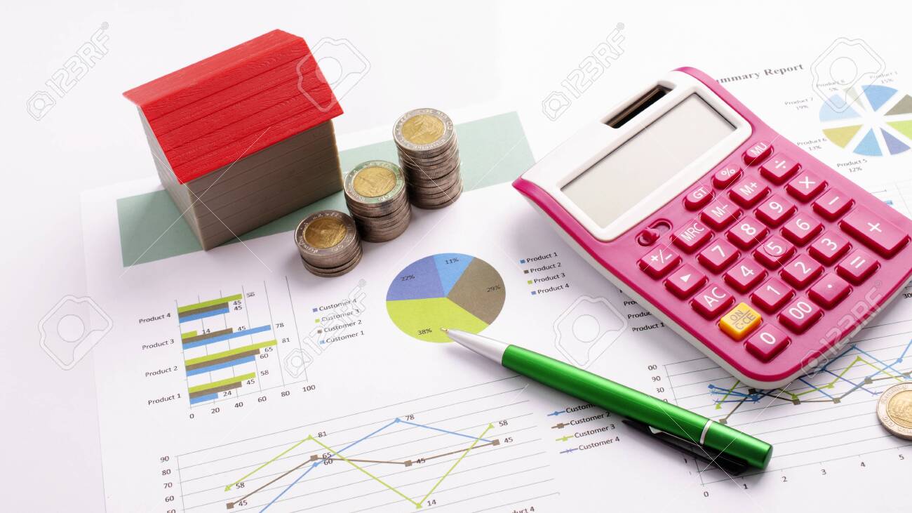 Mortgage loans concept with red house and coin stack, calculator and pen on business report backgrounds - 149155154 Mortgage loans concept with red house and coin stack, calculator and pen on business report backgrounds - 149155154