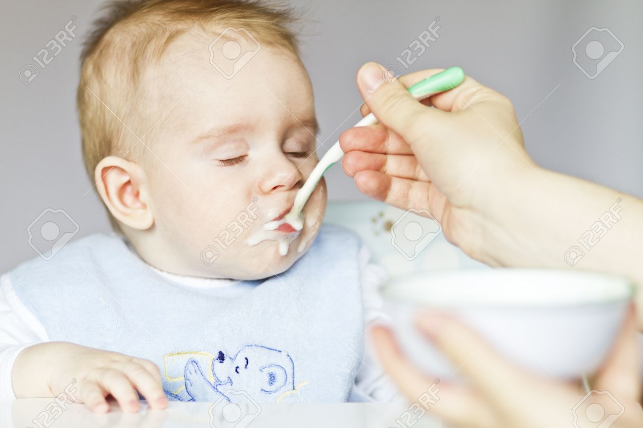 baby eating porridge