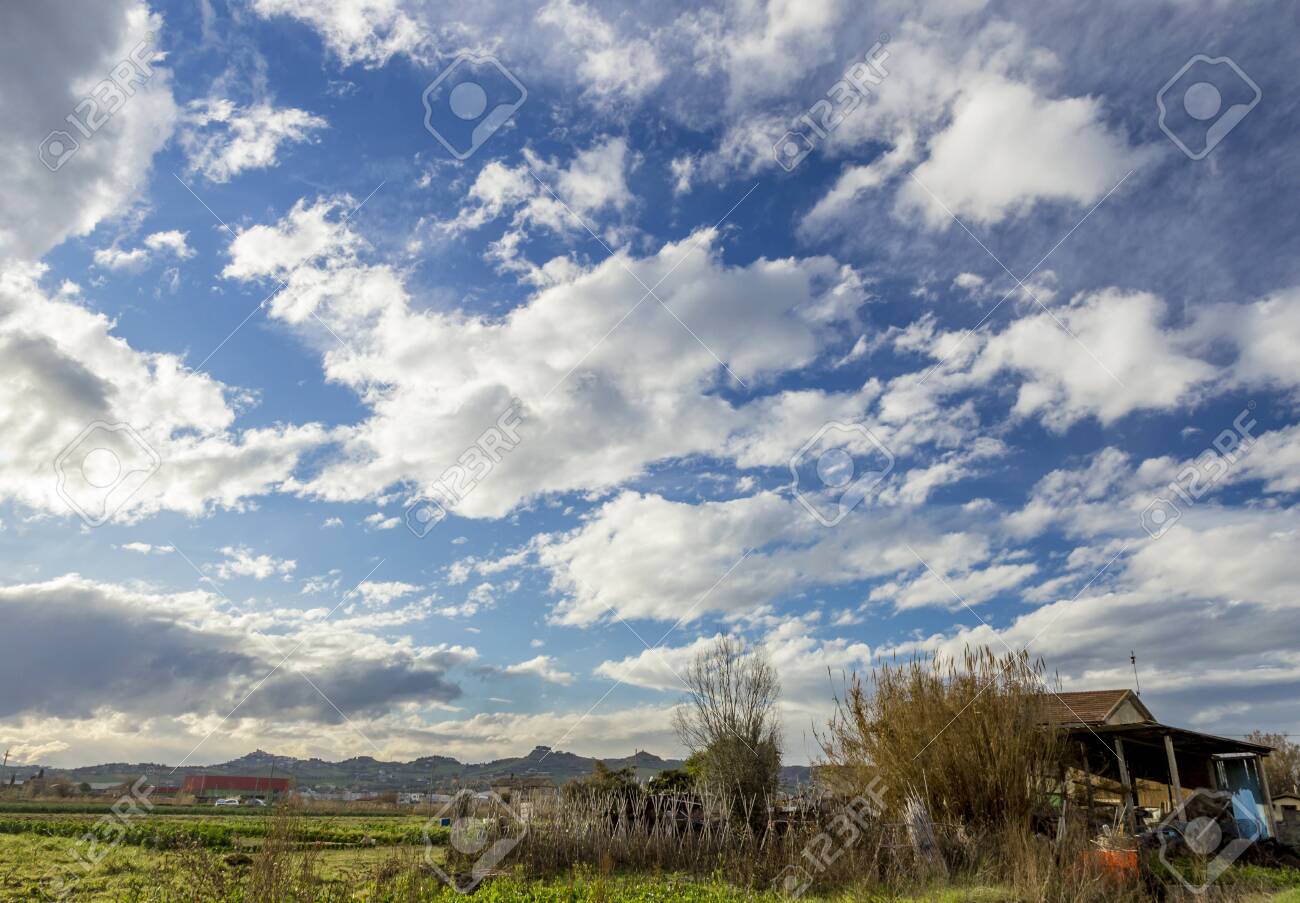 Village House On Field And Cloudy Sky Background Stock Photo Picture And Royalty Free Image Image