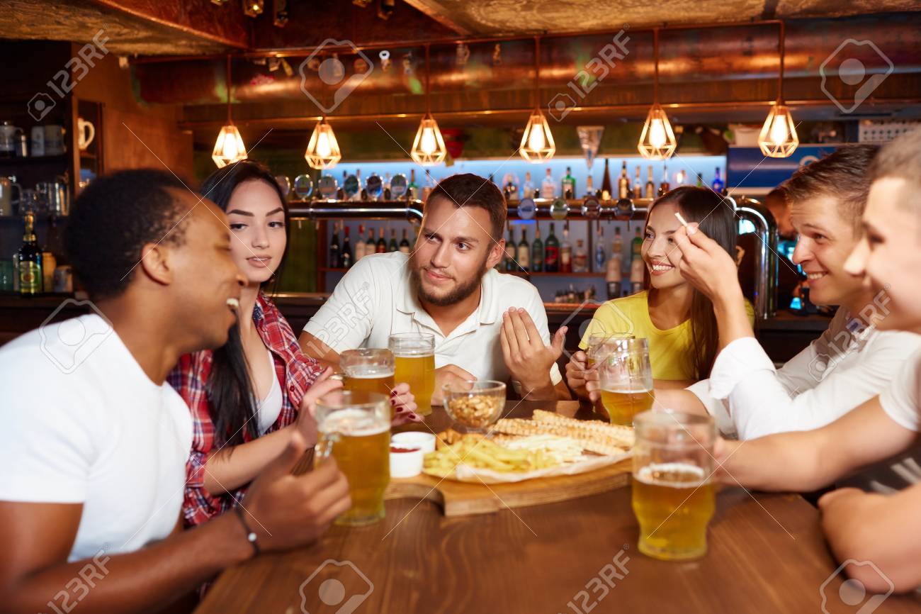 Happy friends group drinking beer at brewery bar restaurant. - 107927660 Happy friends group drinking beer at brewery bar restaurant. - 107927660