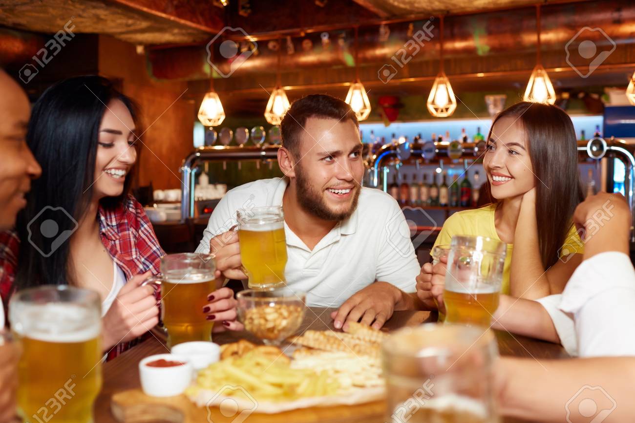 Happy friends group drinking beer at brewery bar restaurant. - 107927751 Happy friends group drinking beer at brewery bar restaurant. - 107927751