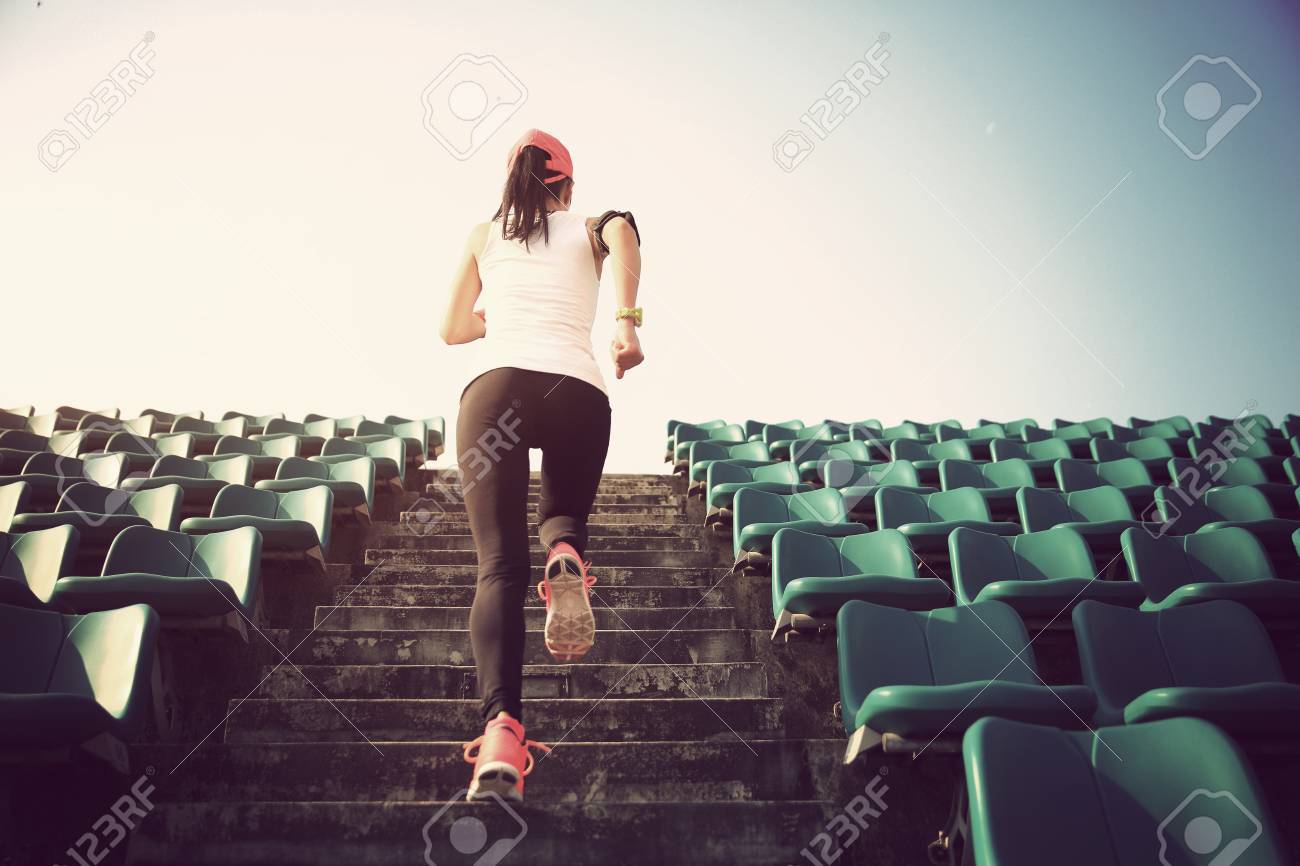 Runner athlete running on stairs. woman fitness jogging workout wellness concept. - 53359230 Runner athlete running on stairs. woman fitness jogging workout wellness concept. - 53359230