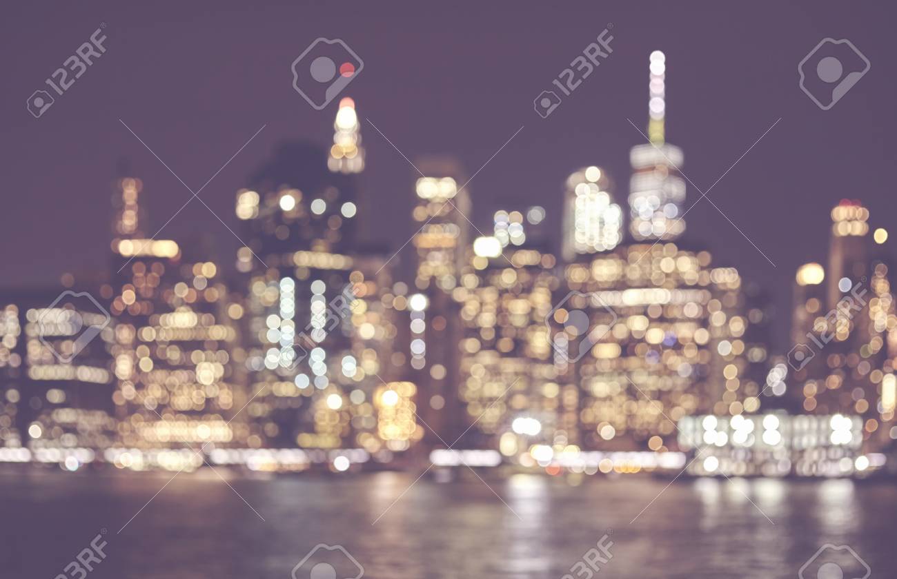 Blurred Retro Toned Picture Of Manhattan Skyline At Night
