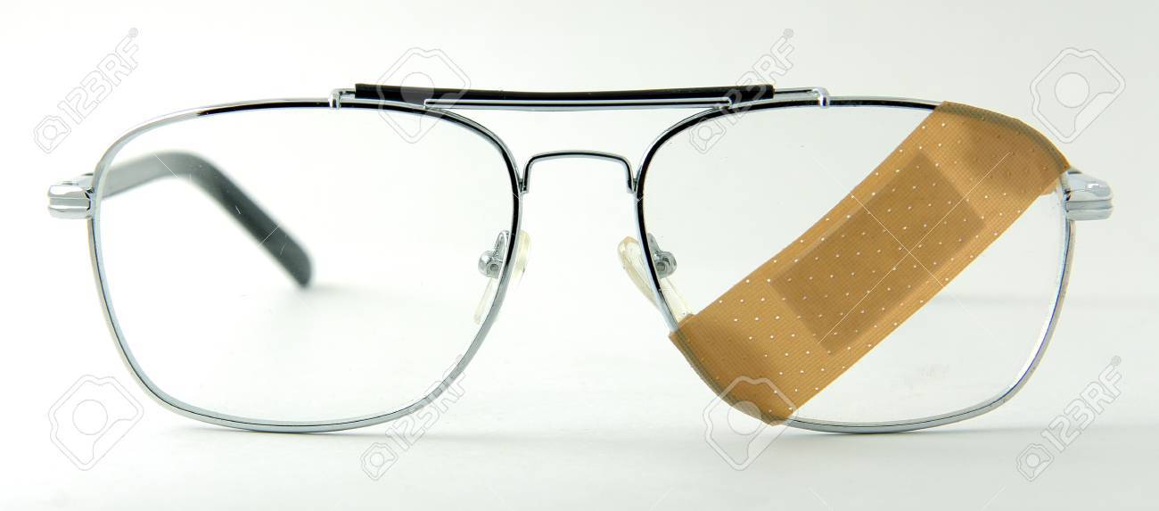 eye glasses with a band aid stock photo picture and royalty free