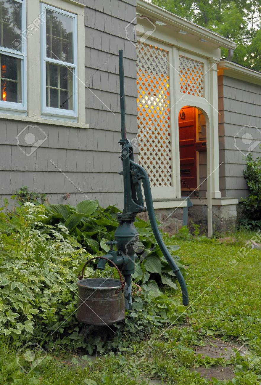 An Outdoor Water Pump By The Side Of A Nice Home Stock Photo Picture And Royalty Free Image Image 29460555