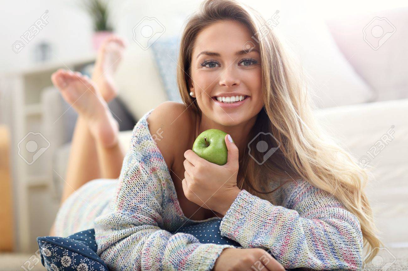 Picture showing happy woman relaxing at home - 72070372 Picture showing happy woman relaxing at home - 72070372