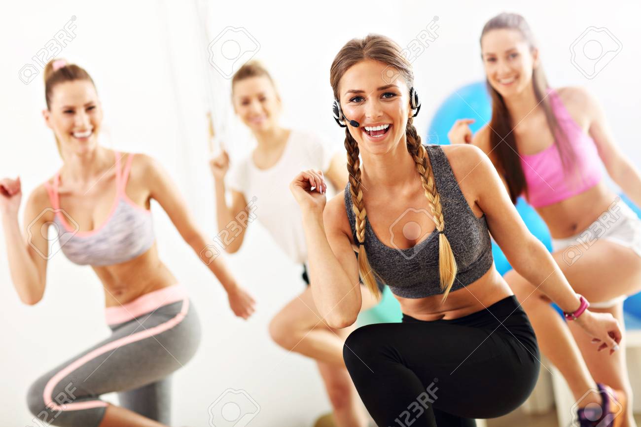 Group of smiling people doing aerobics - 78169056 Group of smiling people doing aerobics - 78169056