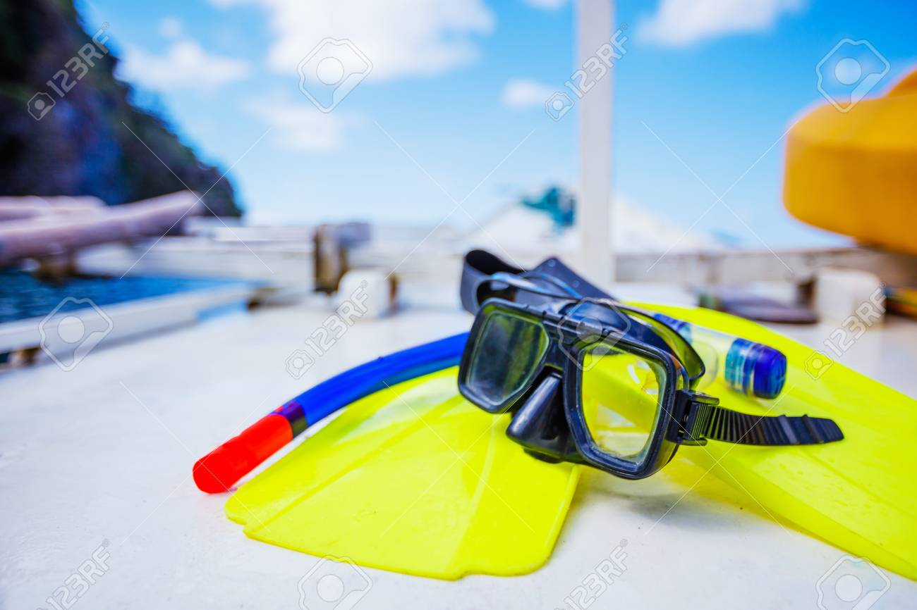 Download Scuba Mask With Yellow Flippers On Wooden Boat Background Stock Photo Picture And Royalty Free Image Image 54892993 PSD Mockup Templates