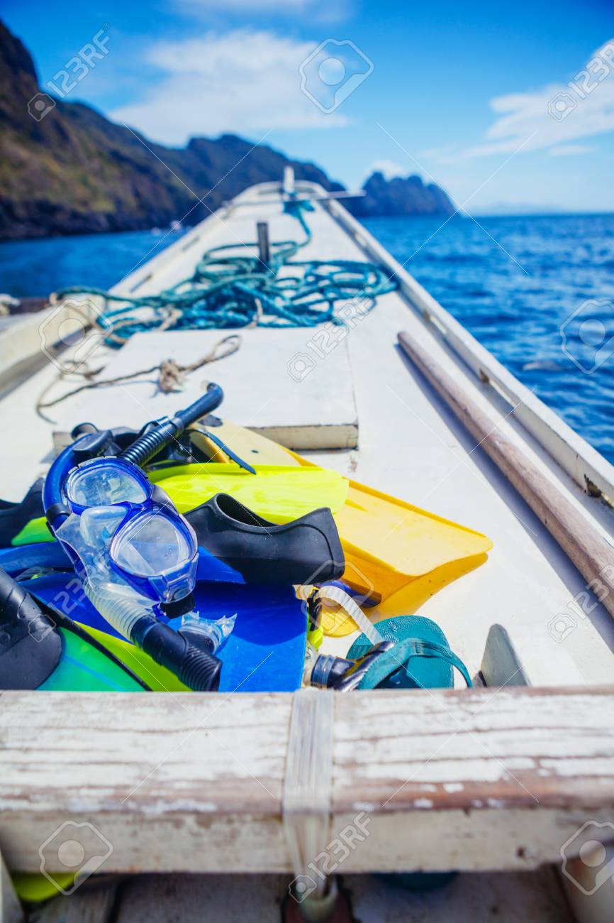 Download Scuba Mask With Yellow Flippers On Wooden Boat Background Stock Photo Picture And Royalty Free Image Image 56798752 Yellowimages Mockups