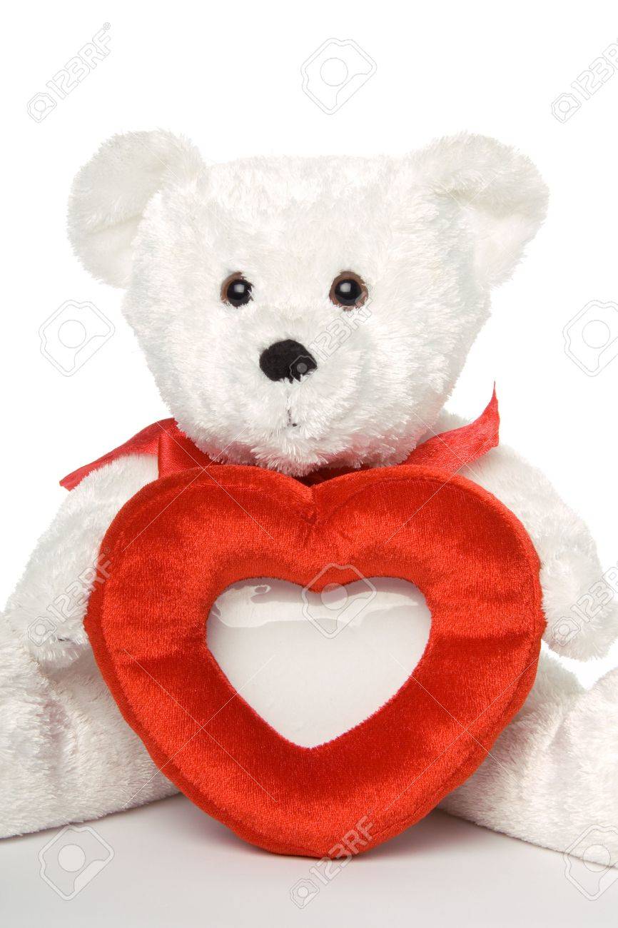 teddy bear holding picture frame