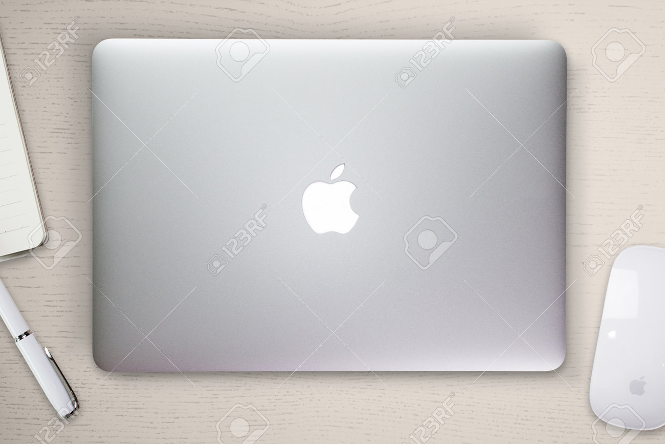 Download Apple Macbook Pro Retina Cover On A Desk Table With Mouse And Stock Photo Picture And Royalty Free Image Image 82384910