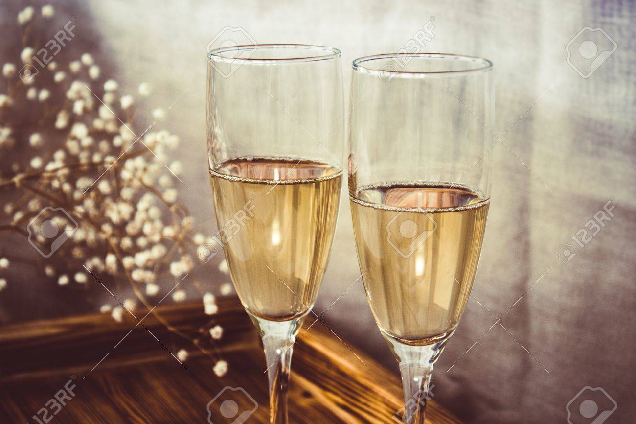 Close Up Of Wine Glasses And Wooden Tray Champagne Flutes On The Wedding Table Close Up Of Wine Glasses And Wooden Tray Champagne Flutes On The Wedding Table