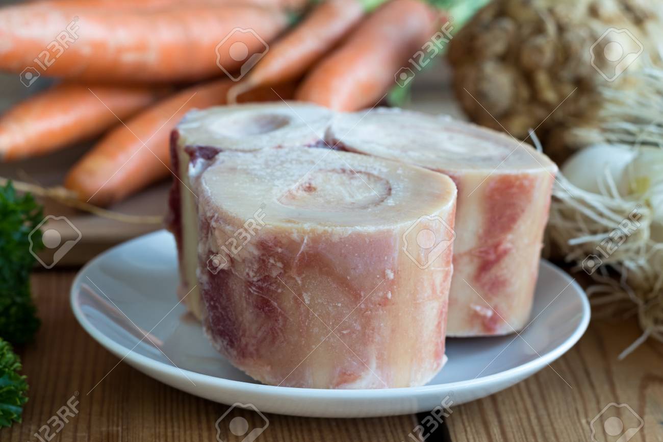 Ingredients for making a beef bone broth - marrow bones, carrots, onions, celery root - 81813148 Ingredients for making a beef bone broth - marrow bones, carrots, onions, celery root - 81813148
