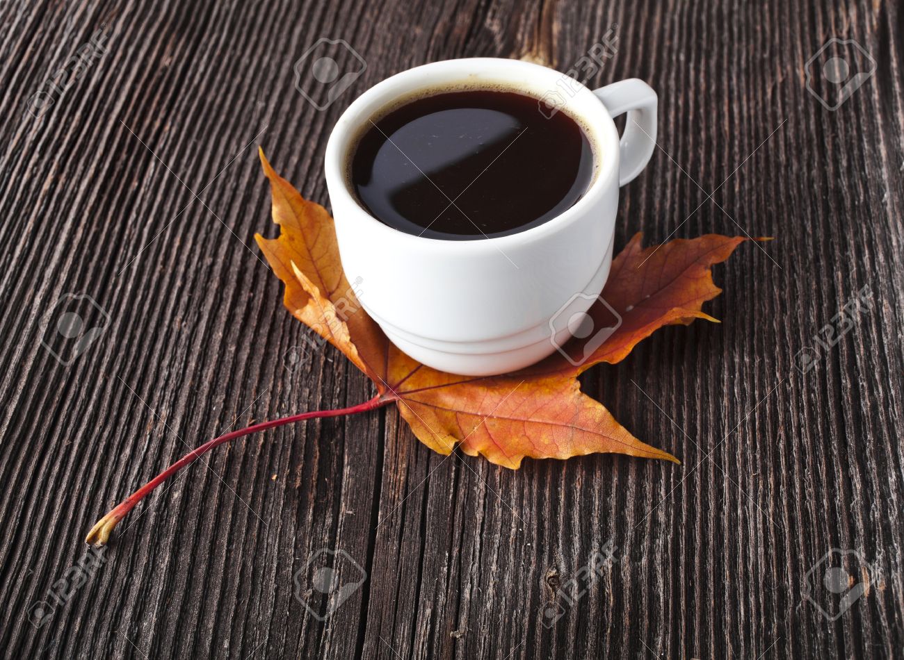 Coffee Cup On The Autumn Fall Leaves And Wooden Vintage Surface Background  Stock Photo, Picture and Royalty Free Image. Image 17787605., image size:1300x950