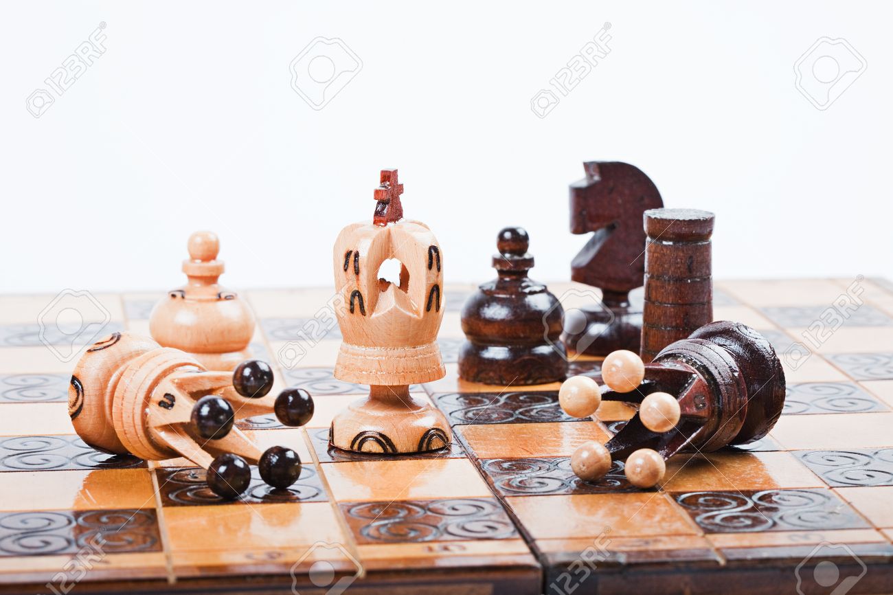 White Chess King Between Fallen Queens Win The Game Surrounded