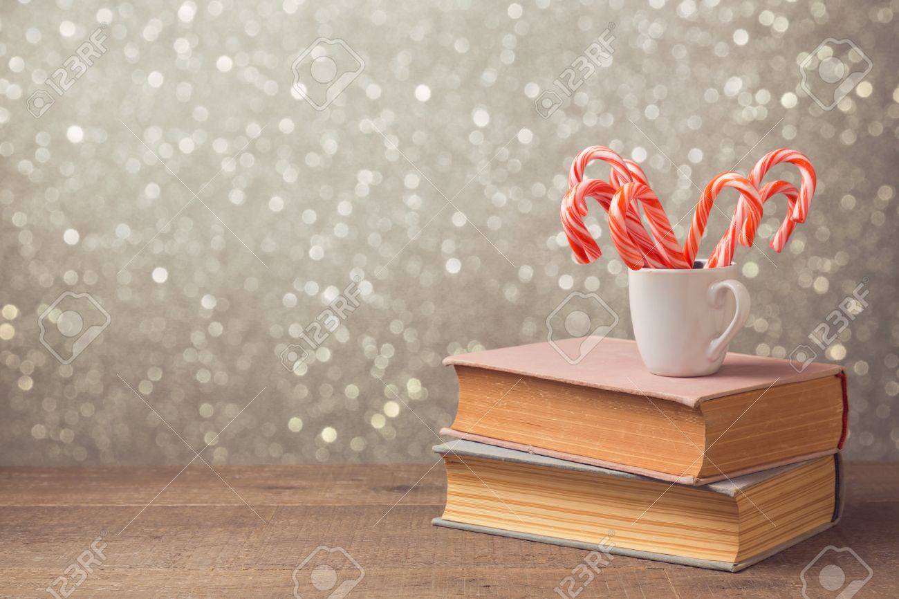 Christmas Celebration With Candy Cane And Cup On Books Over Bokeh Stock Photo Picture And Royalty Free Image Image 50162073