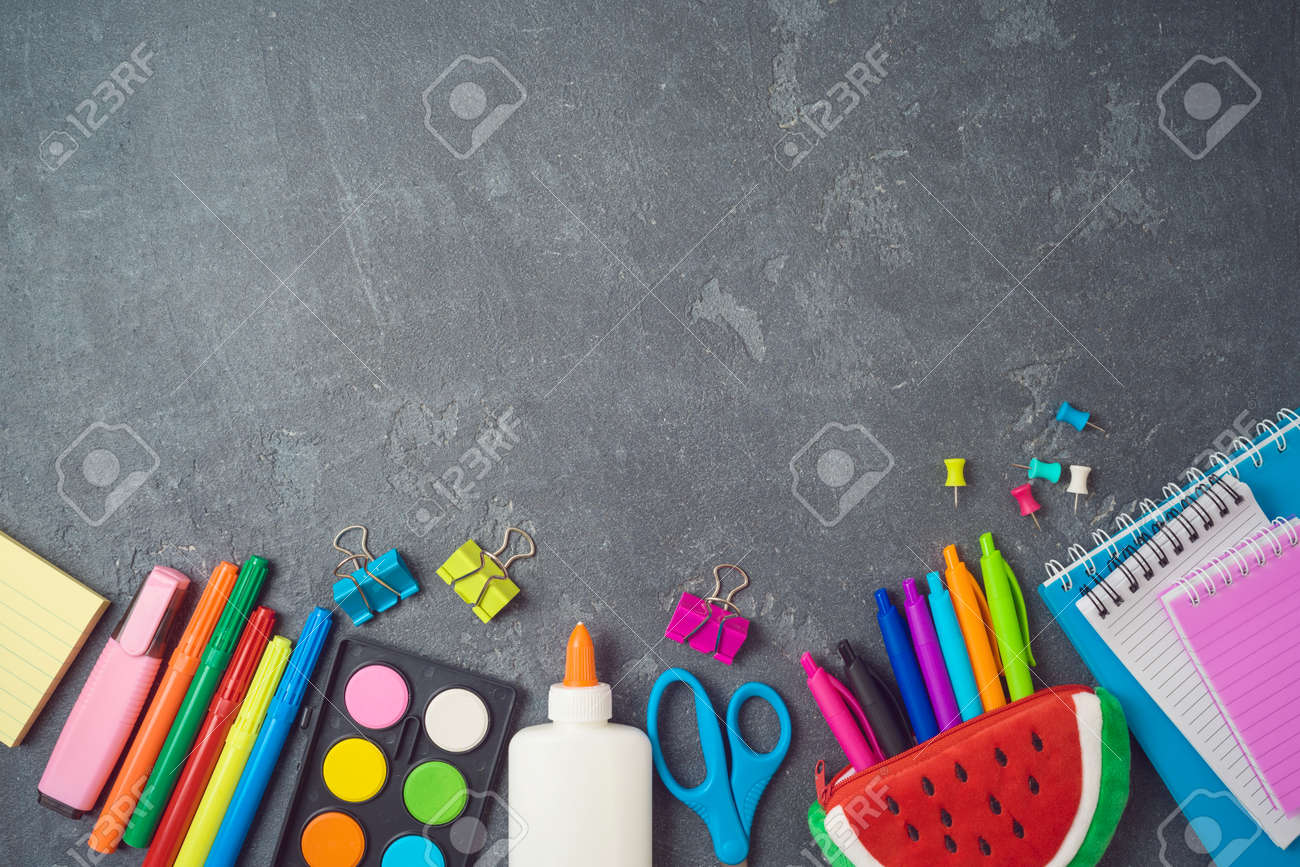 Back to school background with school supplies on blackboard. Top view from above - 125885083 Back to school background with school supplies on blackboard. Top view from above - 125885083