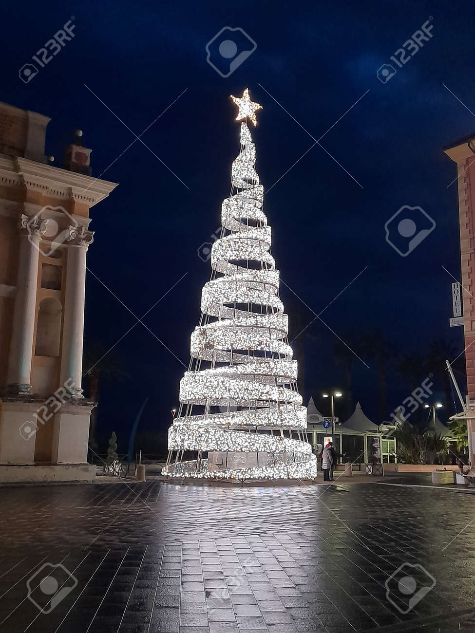 Big Christmas Tree Made Of Lights In A City Square Stock Photo, Picture and  Royalty Free Image. Image 181913510., image size:975x1300