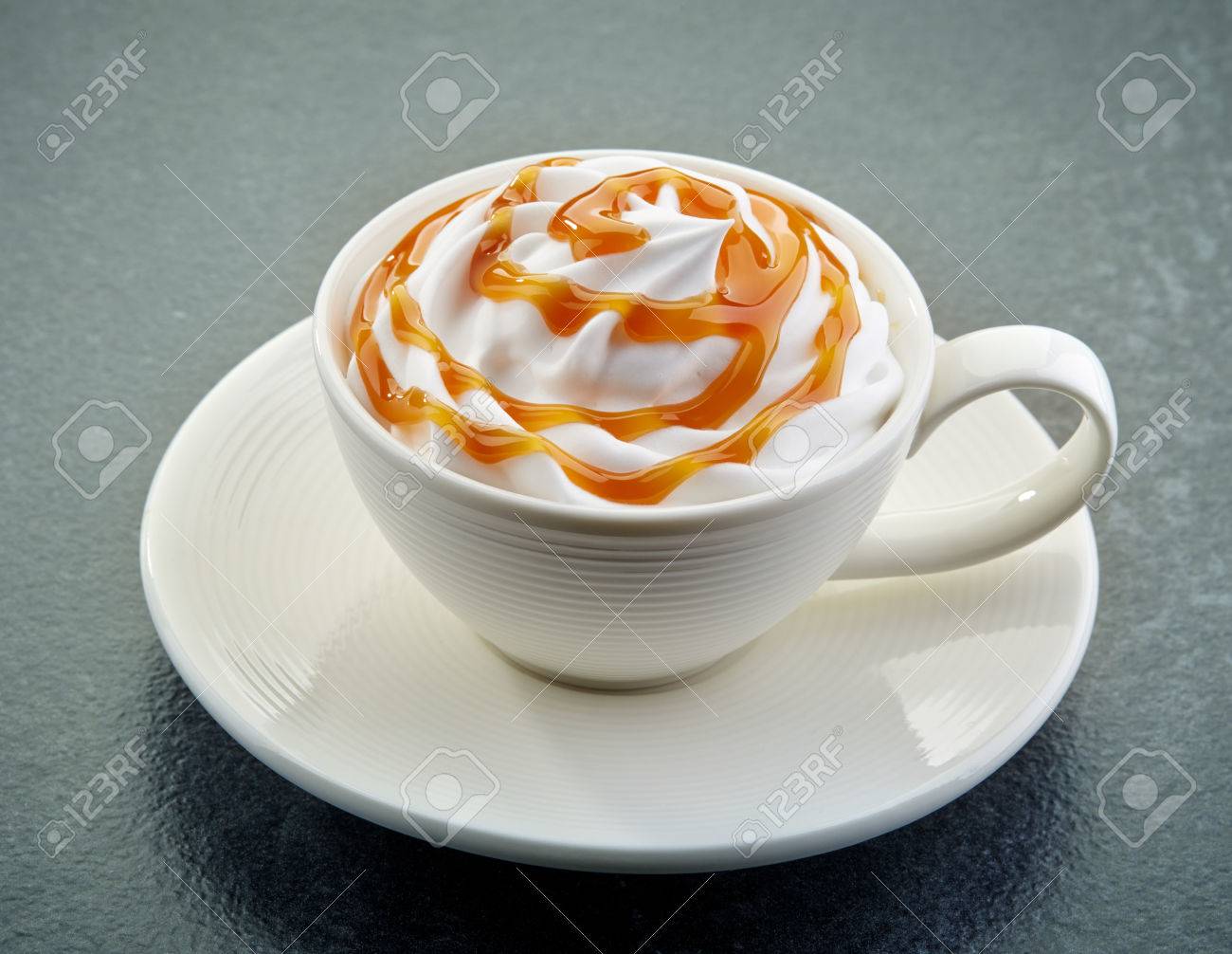 Cup Of Caramel Latte Coffee With Whipped Cream On Dark Background Stock Photo Picture And Royalty Free Image Image 40557364