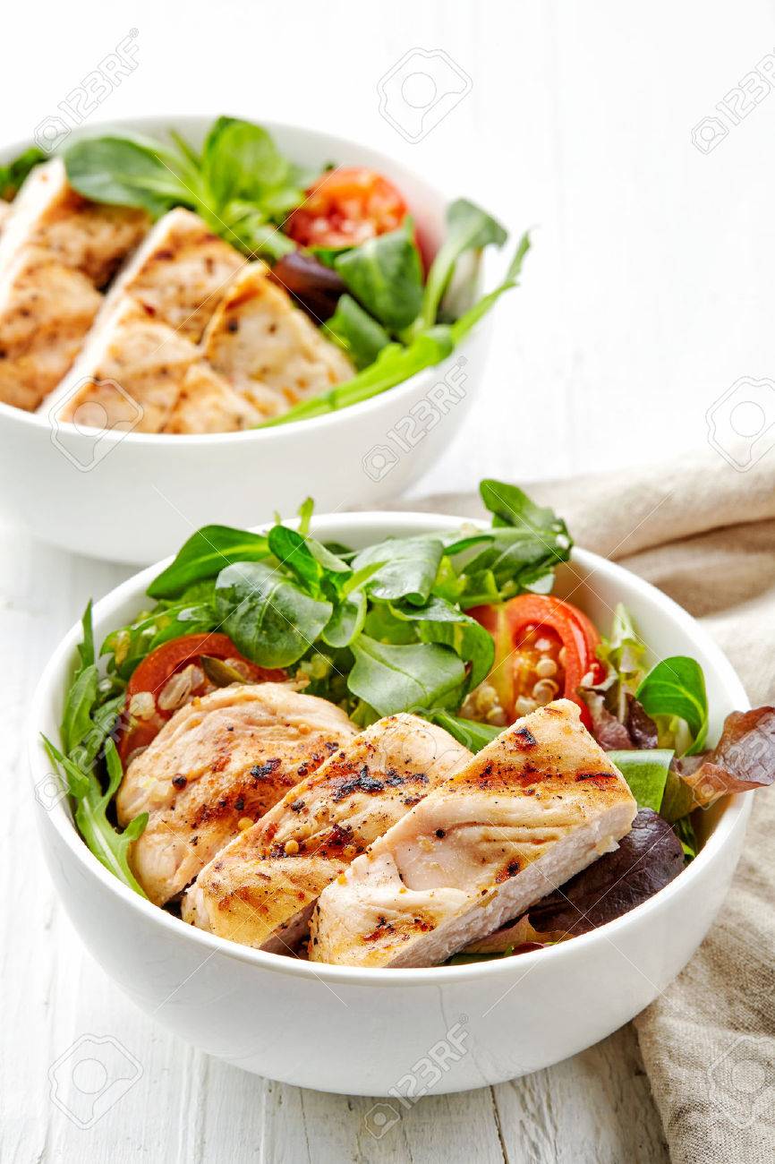 two bowls of vegetable salad with grilled chicken fillet - 50860918 two bowls of vegetable salad with grilled chicken fillet - 50860918