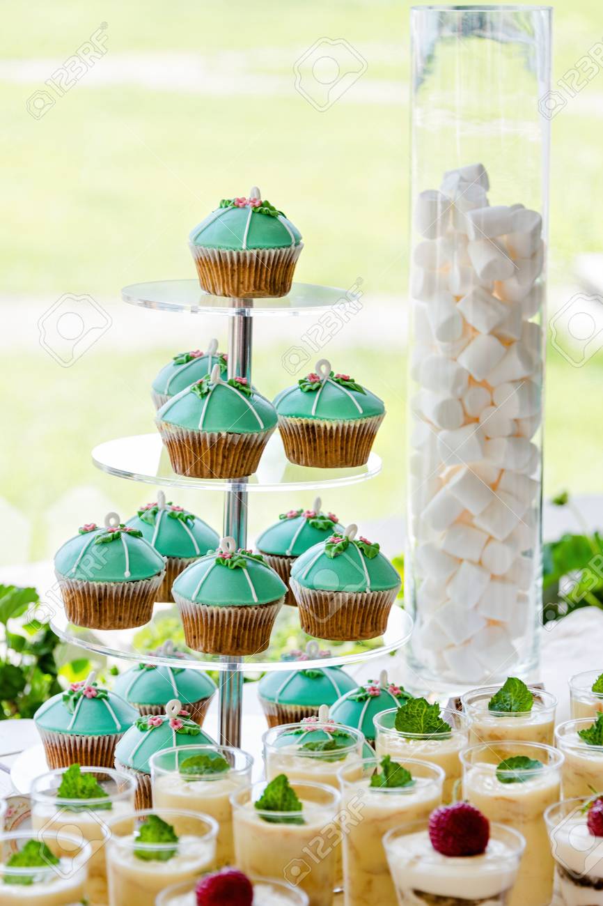 Wedding Cupcake Tower Stand With Turquoise Cakes Stock Photo, Picture and  Royalty Free Image. Image 56709391., image size:866x1300