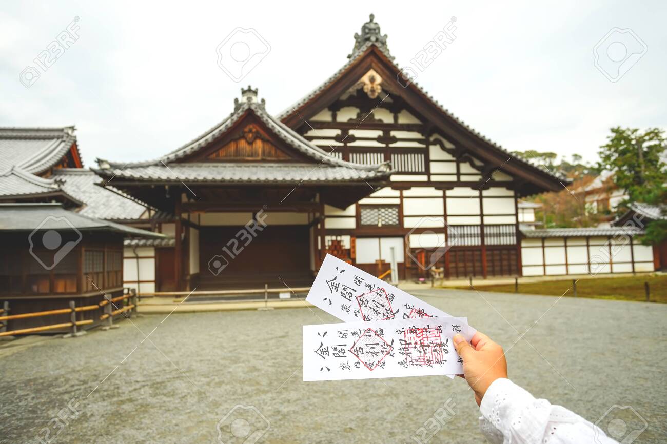 Kyoto Japan December 17 19 Two Tickets Of Kinkakuji Temple On Asian Woman Hand With Japanese Style Building Background Stock Photo Picture And Royalty Free Image Image