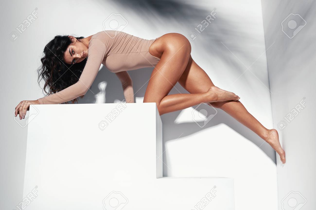 Portrait Of A Sensual Latina Woman With Long, Tanned Legs Stock Photo,  Picture and Royalty Free Image. Image 115550241.