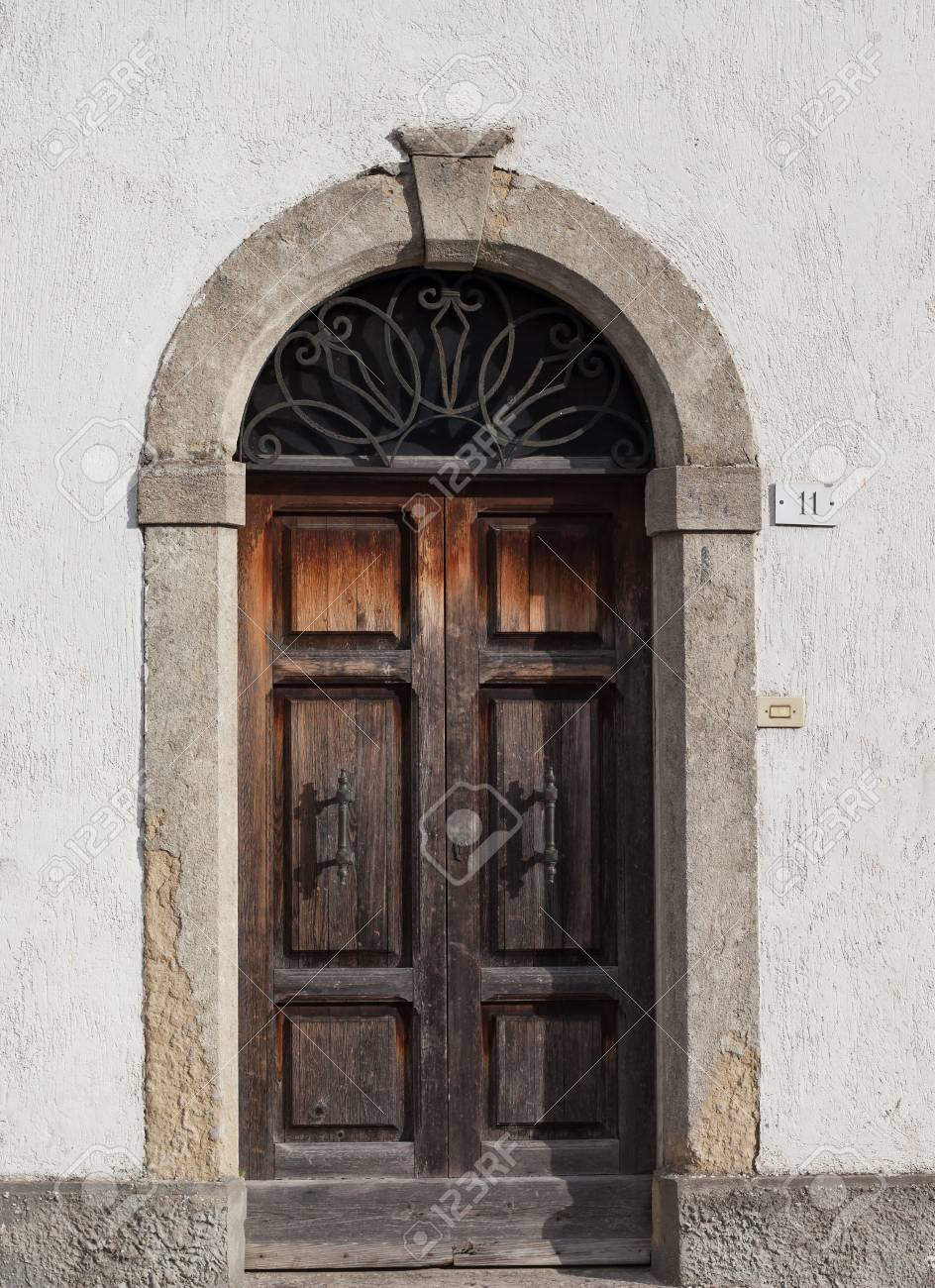 Old wooden door with beautiful metal handles close-up. - 93233800 Old wooden door with beautiful metal handles close-up. - 93233800