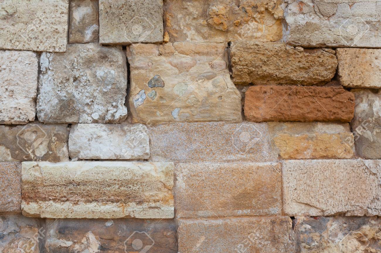 Ancient wall close-up. Background. Old stone wall. - 105827976 Ancient wall close-up. Background. Old stone wall. - 105827976