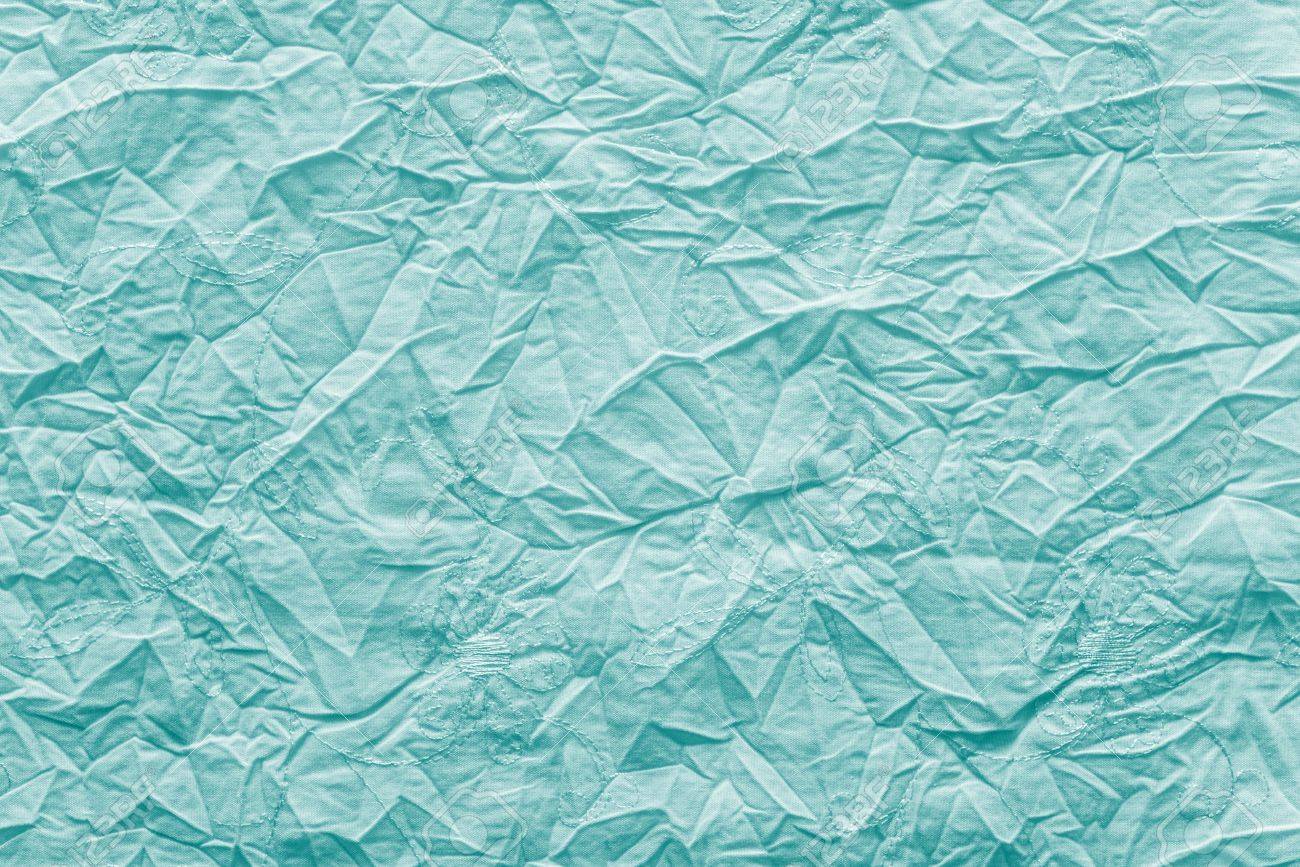 Abstract Crumpled Texture Of Linen Fabric Bright Turquoise Color With Gentle An Embroidery Flowers Abstract Crumpled Texture Of Linen Fabric Bright Turquoise Color With Gentle An Embroidery Flowers