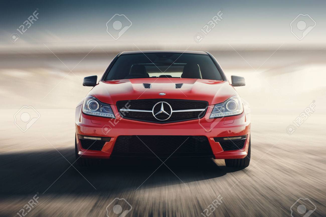 Saratov, Russia - August 24, 2014: Red Sport Car Mercedes-Benz C63 AMG Drive Speed On Asphalt Road At Sunset - 56164735 Saratov, Russia - August 24, 2014: Red Sport Car Mercedes-Benz C63 AMG Drive Speed On Asphalt Road At Sunset - 56164735