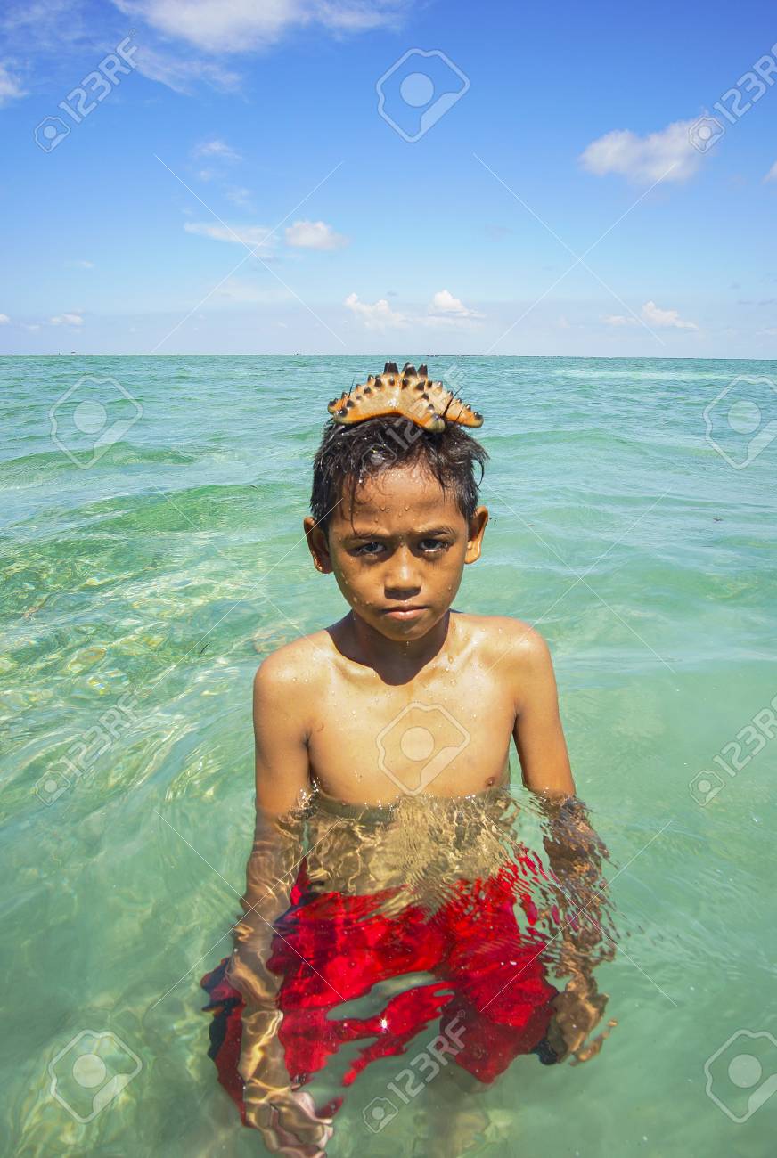 Sabah Malaysia November 19 Unidentified Bajau Laut Kids Put A Beautiful Starfish On His Head At Maiga Island On November 19 2015 Stock Photo Picture And Royalty Free Image Image 51989757