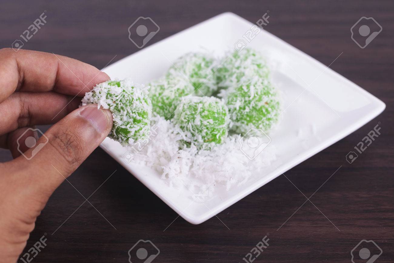 malaysian kuih pastry onde onde or buah melaka on wooden background