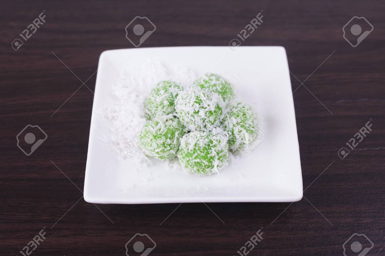 malaysian kuih pastry onde onde or buah melaka on wooden background
