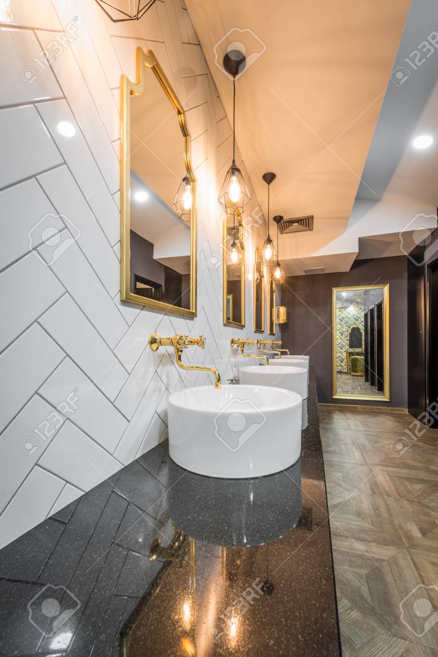 Public Toilet In Modern Hotel Interior Stock Photo, Picture and Royalty  Free Image. Image 86443298., image size:867x1300