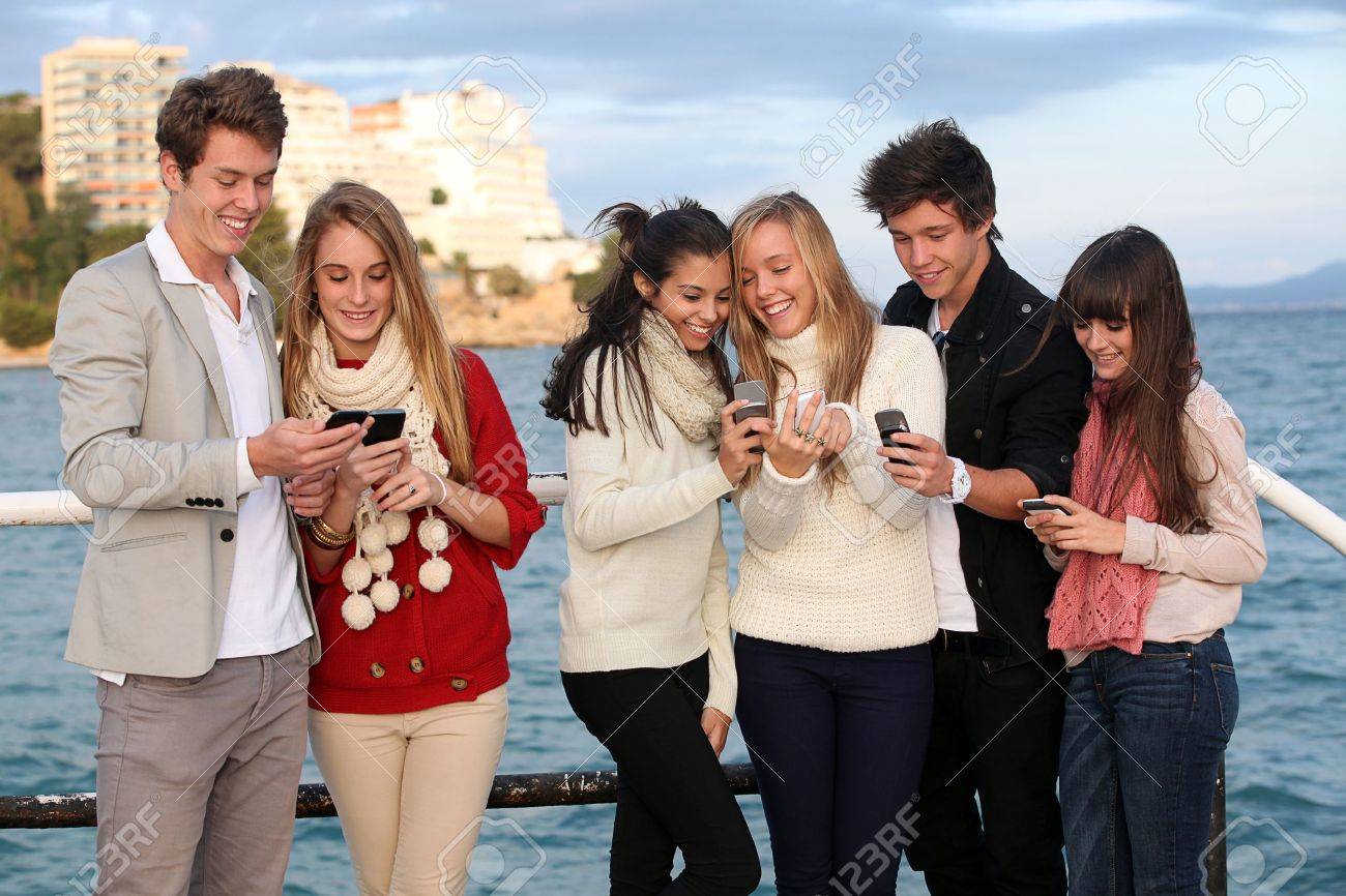 kids texting with mobile or cell phones stock photo picture and