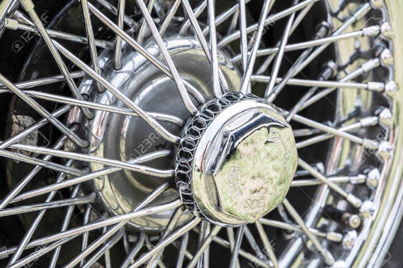 vintage car wheel of an old timer with silver spokes stock photo