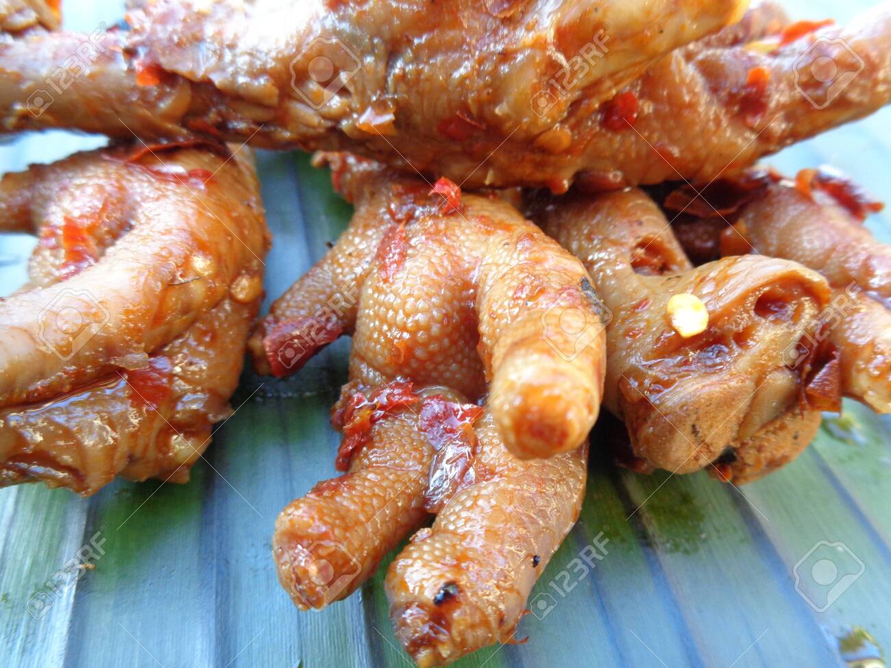 Spicy Grilled Chicken Leg Ceker Ayam Bakar Pedas On Banana Stock Photo Picture And Royalty Free Image Image 141705162