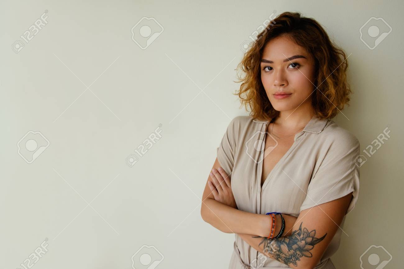 Angry Chinese Girl Feeling Irritation. Young Asian Woman Looking At Camera  With Arms Crossed. Annoying Concept Stock Photo, Picture and Royalty Free  Image. Image 108650845.
