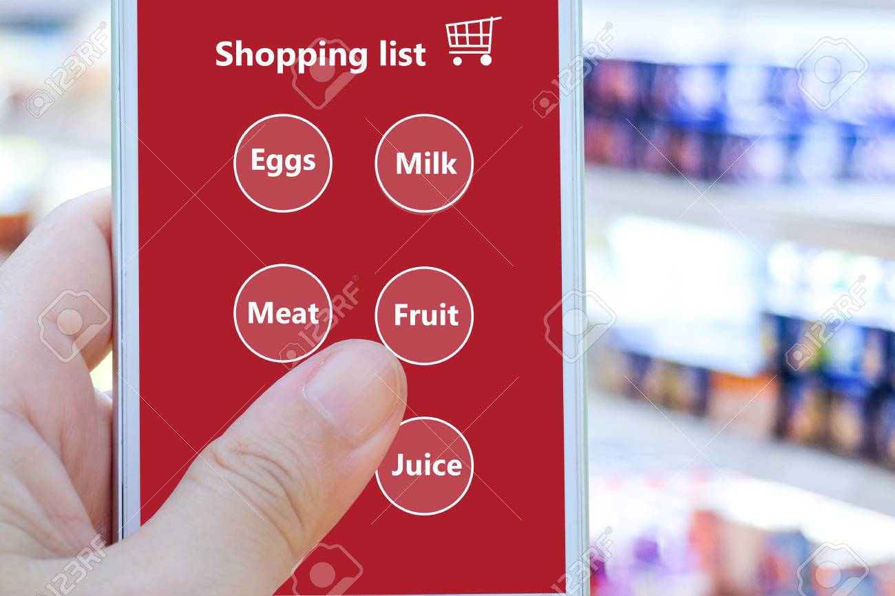 hand holding smart phone with grocery shopping check list business phone list