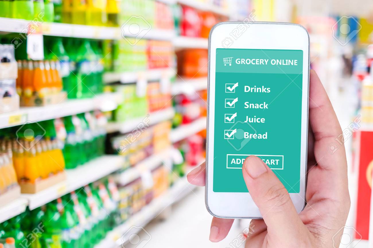 hand holding smart phone with grocery shopping check list online